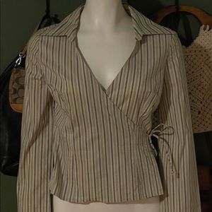 Grooviest authentic vintage 1970’s wrap top with a dagger collar.